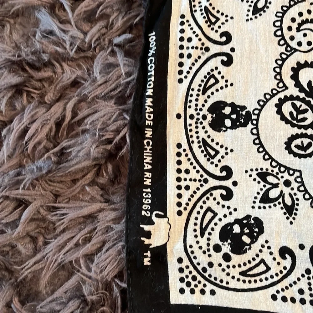 100% cotton bandanna black and white with skulls and paisley.